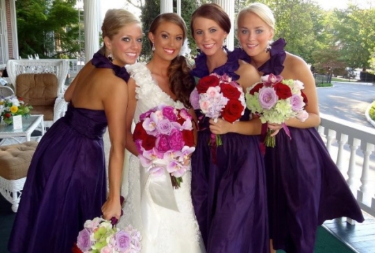 The eggplant bridesmaids dresses and the flower colors were stunning